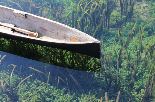 Boat on lake with transparent water