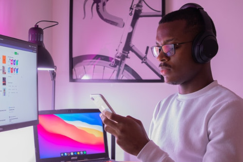 Young man looking frustrated at his phone